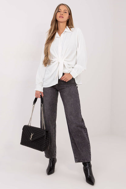 The feminine puffy sleeves and cuff detail of a high-quality women's long sleeve polyester shirt by Factory Price.
