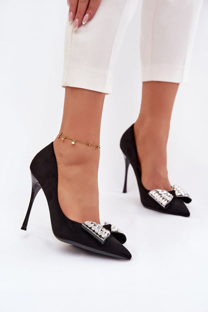 Close-up of the crystal bow detail on women's high heels in faux suede by Step in Style, highlighting the luxurious craftsmanship and sophisticated style.