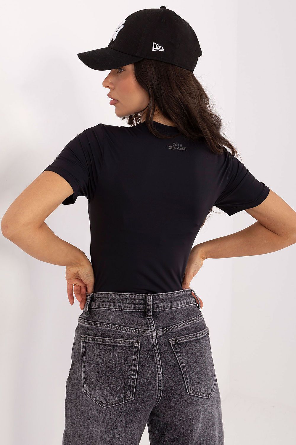 Sublevel women's blouse displayed on mannequin, highlighting comfortable fit and chic short sleeves, suitable for layering with cardigans or jackets.