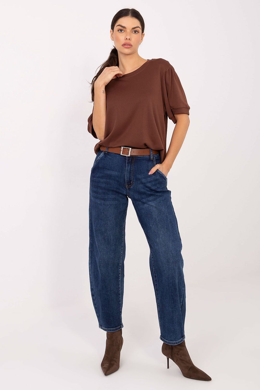 Model wearing Luxury Women's High Waist Tapered Jeans by Factory Price, demonstrating versatility for everyday chic outfits.