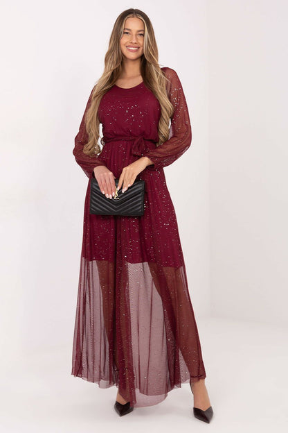 Elegant long mesh maxi dress by Italy Moda featuring a tie belt and flared cut, perfect for special occasions.