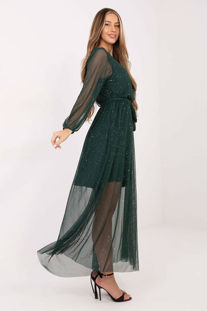 Profile view of Italy Moda's stunning long mesh maxi dress, featuring long sleeves and a round neckline, ideal for evening events and parties.