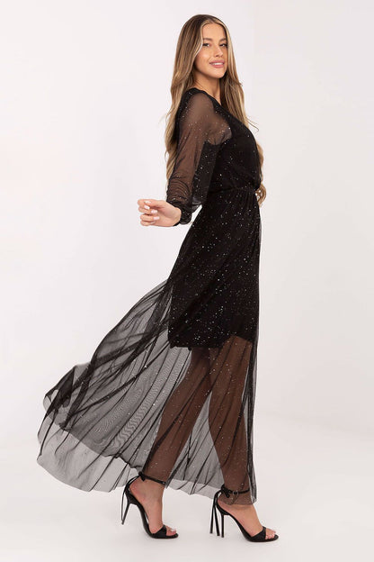 Elegant long mesh maxi dress by Italy Moda featuring a tie belt and flared cut, perfect for special occasions.