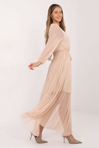 Elegant long mesh maxi dress with tie belt and flared cut from Italy Moda, perfect for special occasions, showcasing intricate detailing and a feminine silhouette.