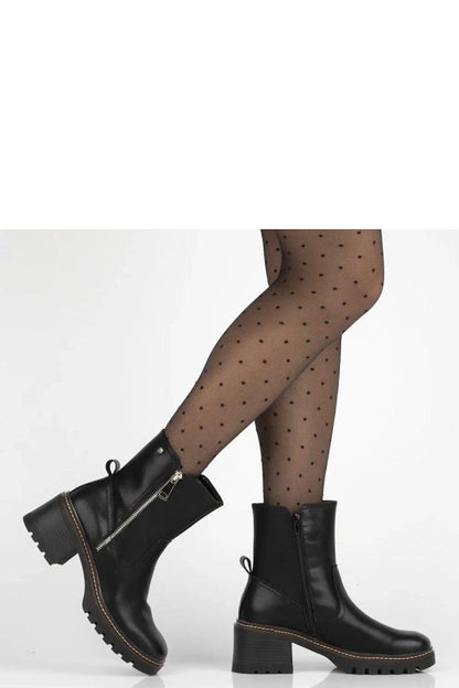 Brenda Black Leather Ankle Boots with 6.5 cm Stiletto Heel by Solea, showcasing timeless elegance, impeccable craftsmanship, and comfort, perfect for versatile outfits during autumn and winter.