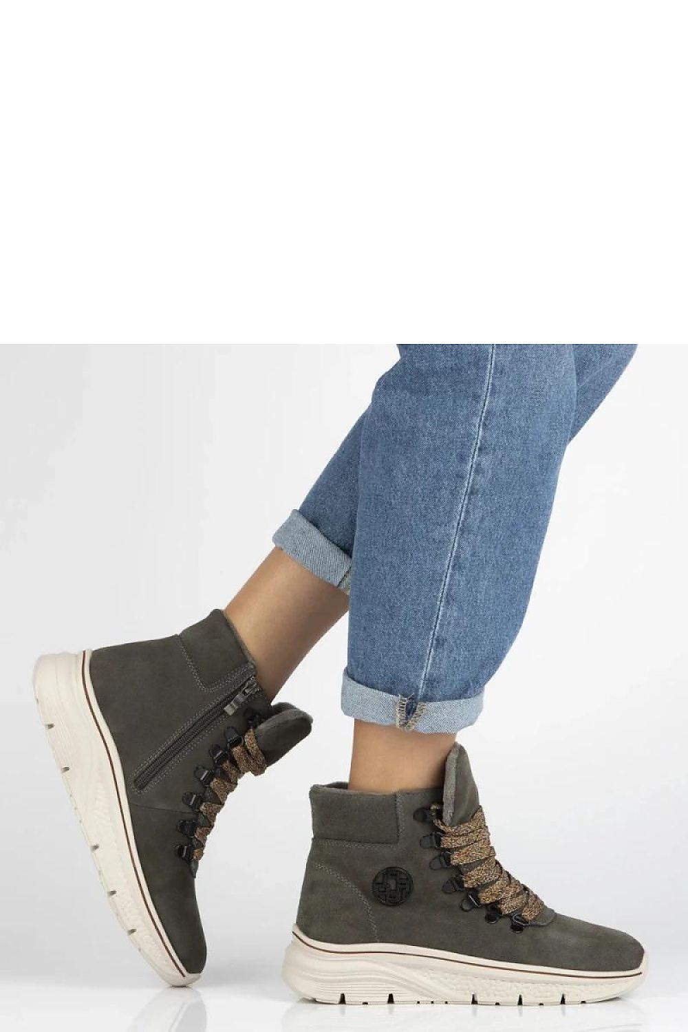 Close-up view of Solea's grey suede ankle boots showcasing intricate lacing detail, epitome of luxury and comfort.