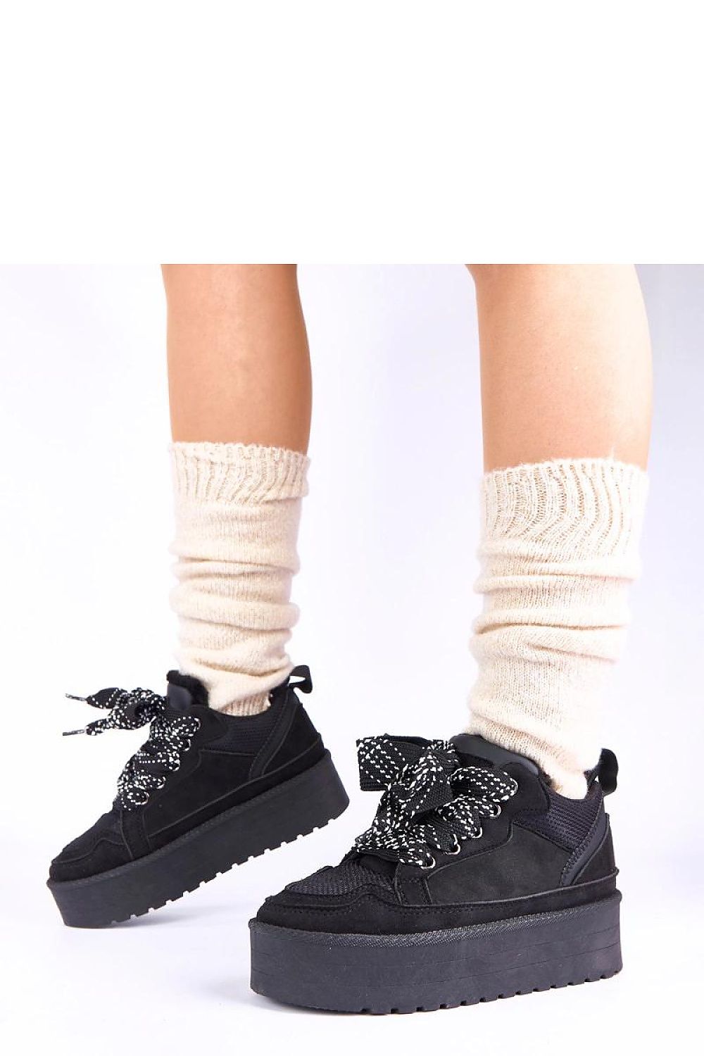 Solea's sophisticated Gemre Sesuna Black Platform Sneakers with trendy decorative laces, perfect for elevating casual and bold streetwear outfits.