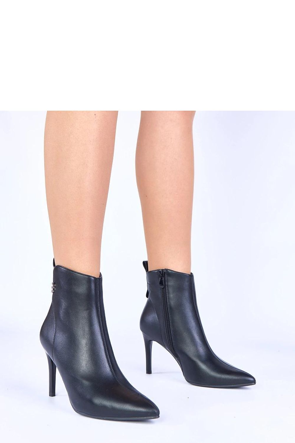 Elegant black stiletto ankle boots Zula by Solea featuring stylish rhinestone embellishments, perfect for luxurious evening wear.