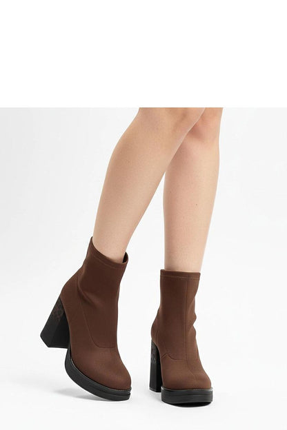 Stylish Delora Stiletto Ankle Boots by Solea paired with a modern outfit, demonstrating versatility for both casual outings and elegant occasions.