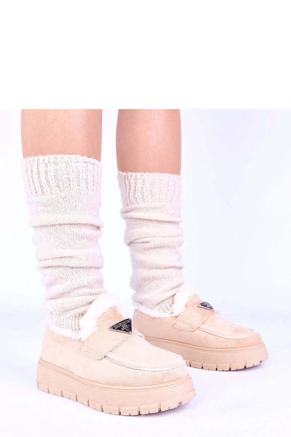 Elevated view of dark beige moccasins on Kirby platform by Solea, emphasizing the chic profile and stylish silhouette perfect for sophisticated looks.