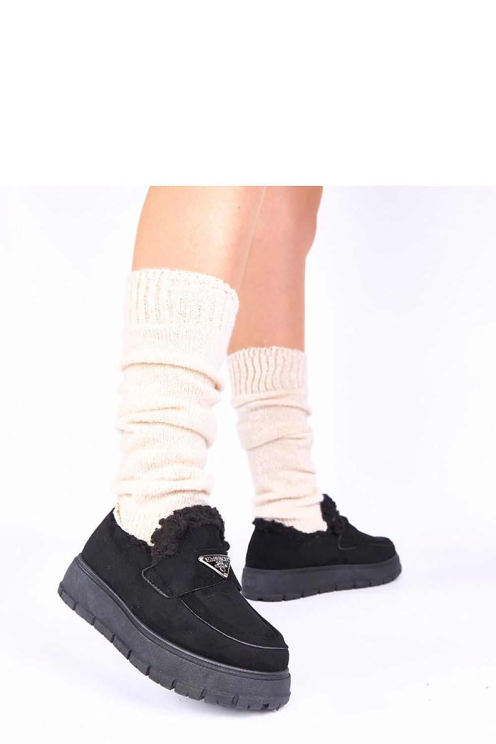 Elegant dark beige fur-lined moccasins from Solea on Kirby platform, designed to enhance style and comfort while keeping feet warm.