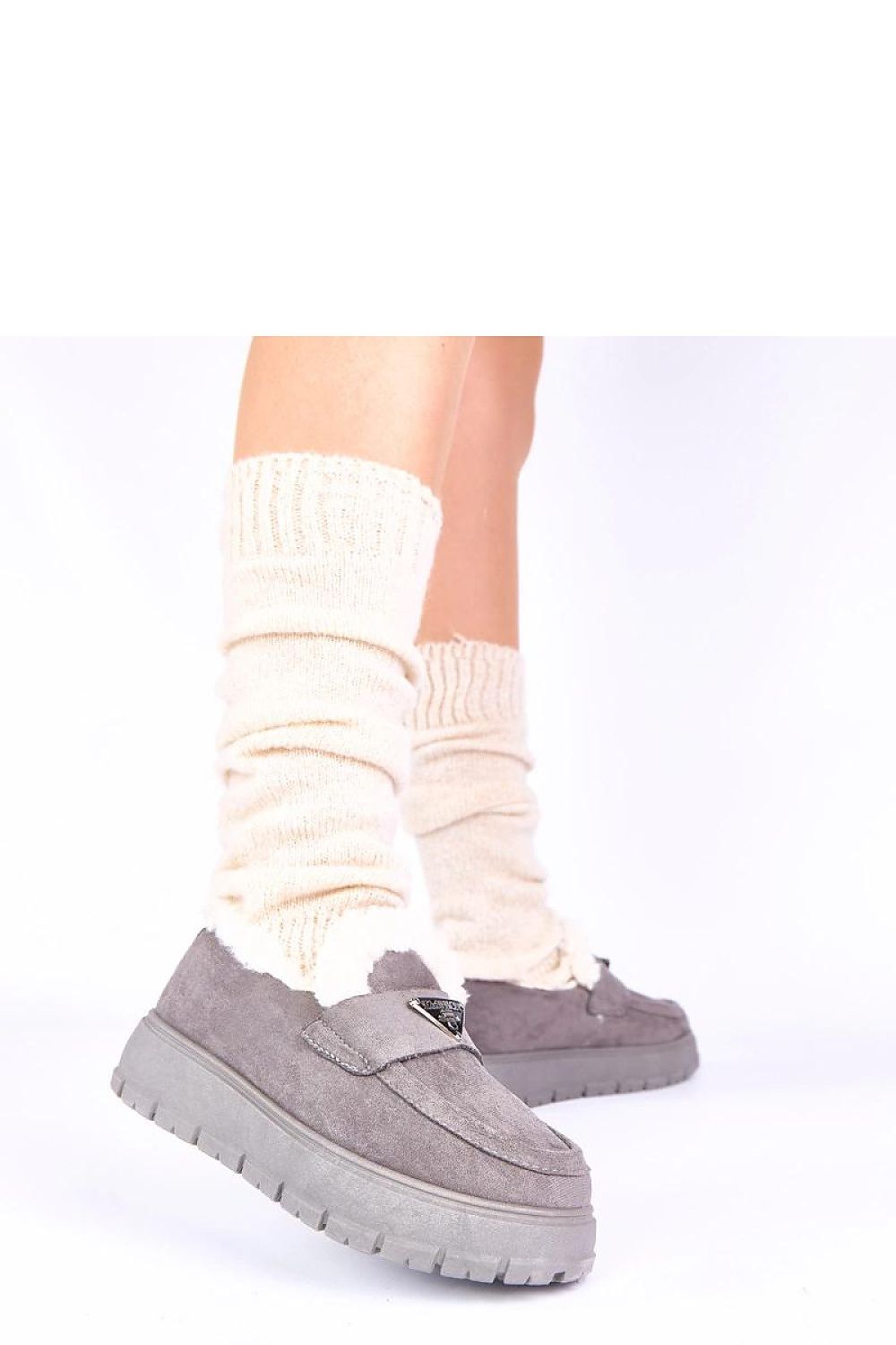 Close-up of Solea dark beige women's moccasins with fur lining, highlighting the sophisticated craftsmanship and minimalist style ideal for both casual and elegant outfits.