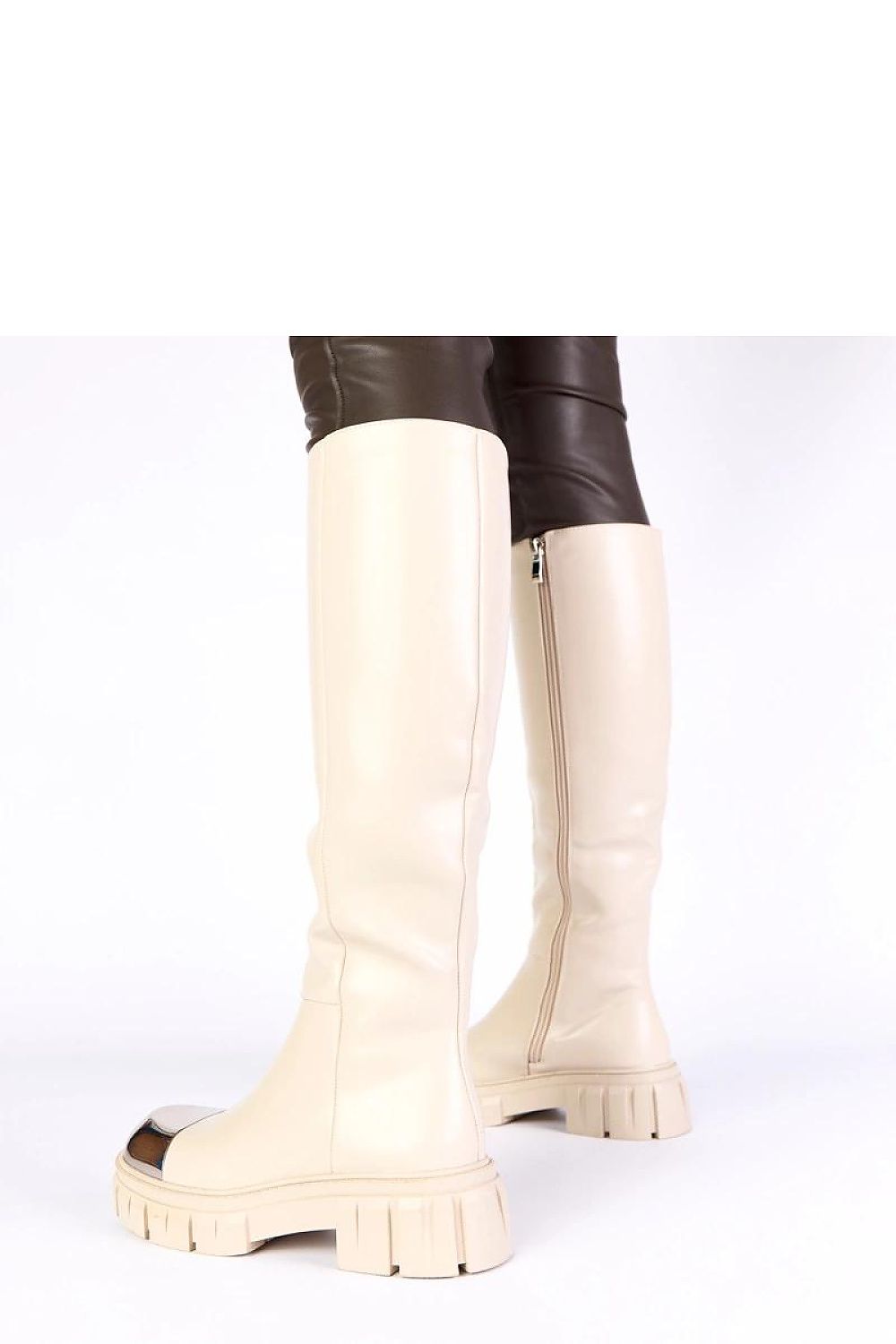Solea beige thigh-high boots displayed with a focus on their versatile design, ideal for casual and elegant looks.