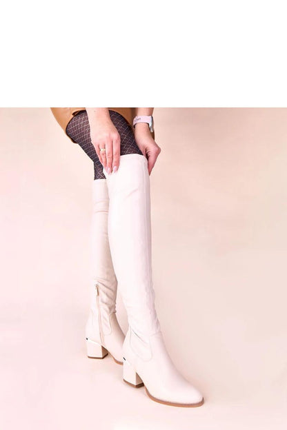 Chic beige flat over-the-knee boots with a stylish block heel, crafted by Solea, offering versatility for both everyday and formal outfits.