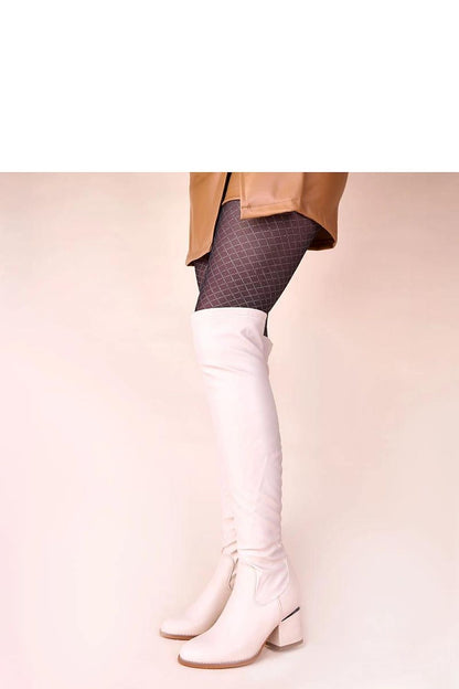 Solea's sophisticated beige over-the-knee boots featuring a modern block heel, epitomising contemporary fashion and comfort for the discerning woman.