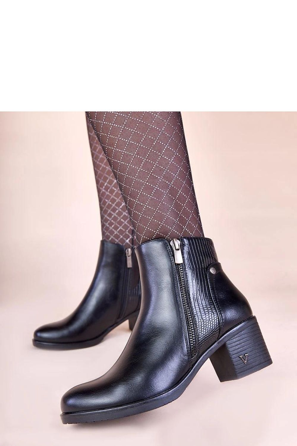 Stylish block heel ankle boots from Solea in classic black, designed for comfort and sophistication, perfect for any occasion.