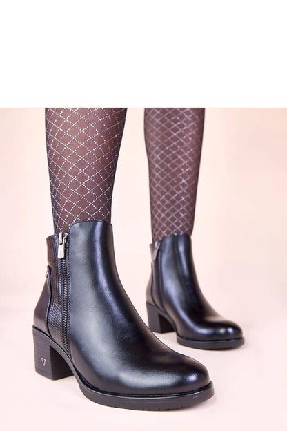 Elegant black ankle boots with block heel by Solea, featuring a stylish decorative upper, perfect for sophisticated autumn-winter fashion, available in sizes EU 36 to 41.