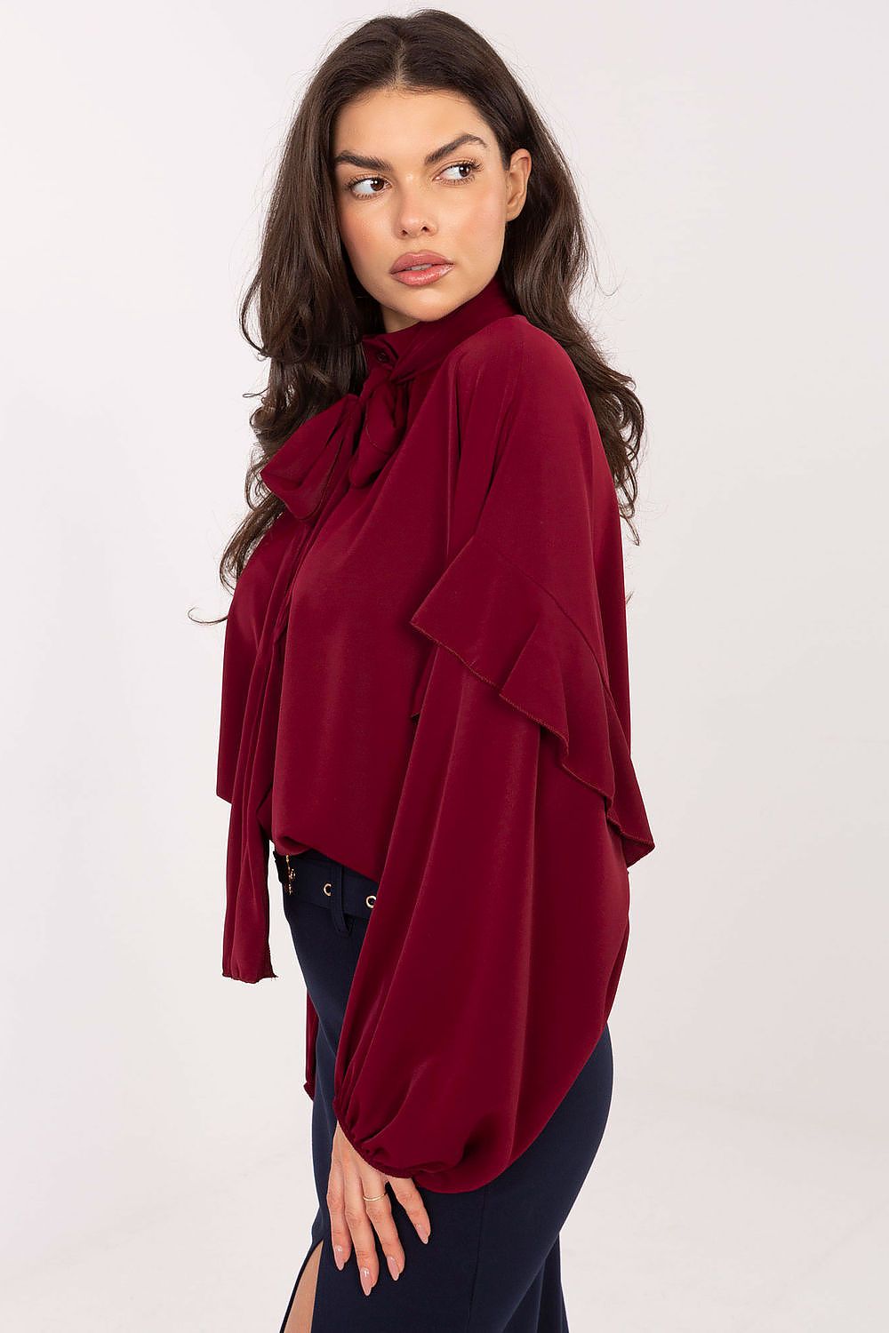 Sophisticated women's long sleeve shirt by Factory Price, featuring elegant ruffles and a classic style, perfect for both elegant trousers and skirts.