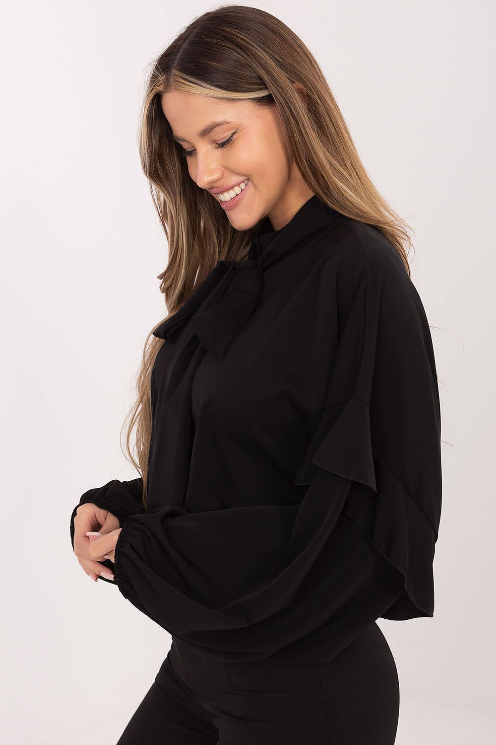Luxurious women's collarless shirt by Factory Price placed on a decorative backdrop, highlighting its elegant ruffle design and flattering silhouette.