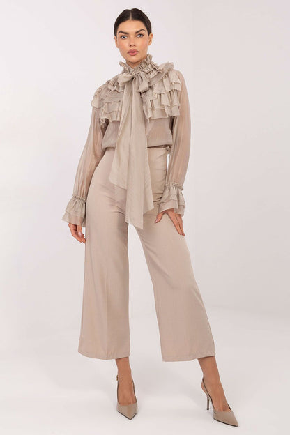 Close-up detail of an elegant women's long sleeve shirt with jabot tie and flounce sleeves by Factory Price, highlighting high-quality Tencel-polyester blend fabric.