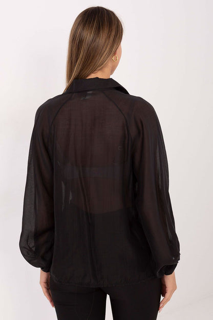 Model wearing the elegant long sleeve shirt by Factory Price, showcasing its flowy silhouette and sophisticated design for both casual and formal occasions.