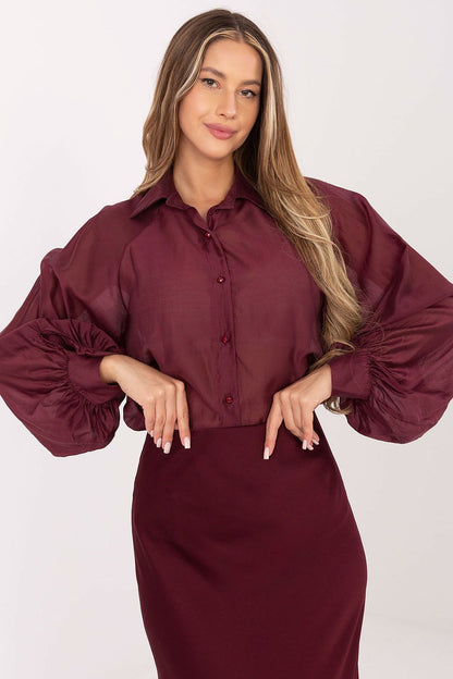 Graceful long sleeve women's top by Factory Price, designed with a slightly transparent finish and a classic cut suitable for both formal and casual occasions.