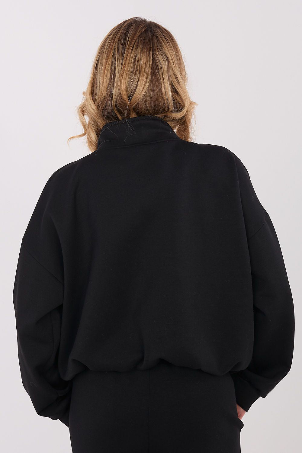 Close-up of the soft polyester blend fabric of the luxurious women's sweatshirt by Factory Price, showcasing its quality and elegance.