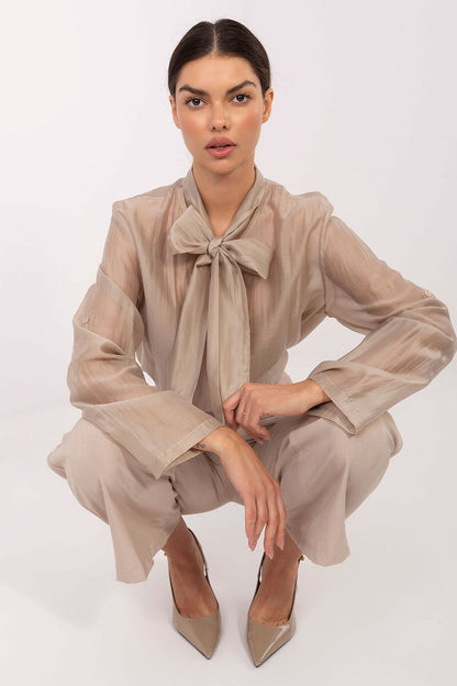 Showcasing the sleek design and elegant drape of the Elegant Women's Long Sleeve Shirt, tailored in a luxurious Tencel-Polyester fabric, available from Factory Price.