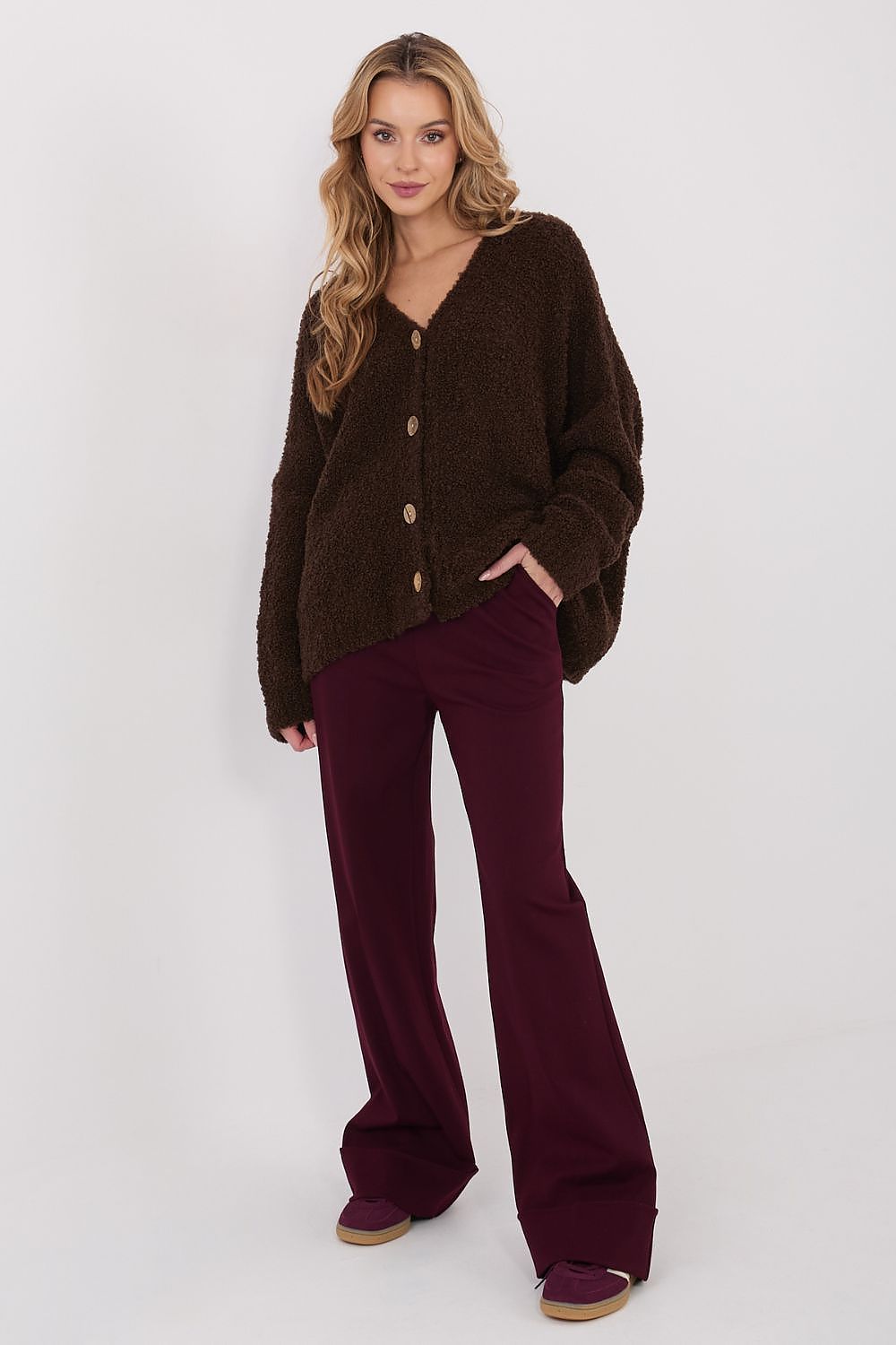 Flatlay of the Elegant Women's Cardigan Sweater by Factory Price, paired with accessories, demonstrating its versatility for work or casual outings.
