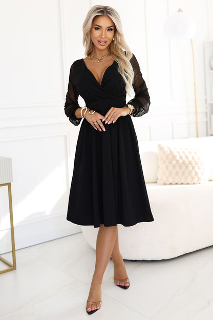 Elegant black midi dress by Numoco featuring delicate tulle sleeves, perfect for formal occasions.