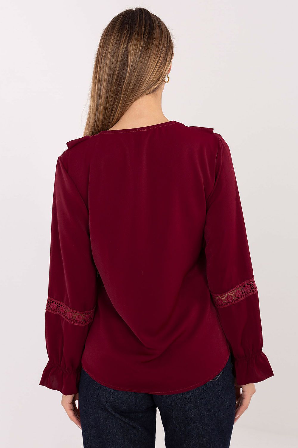 Italy Moda elegant women's blouse displayed on a mannequin, highlighting the flattering fit and intricate ruffle sleeve design.