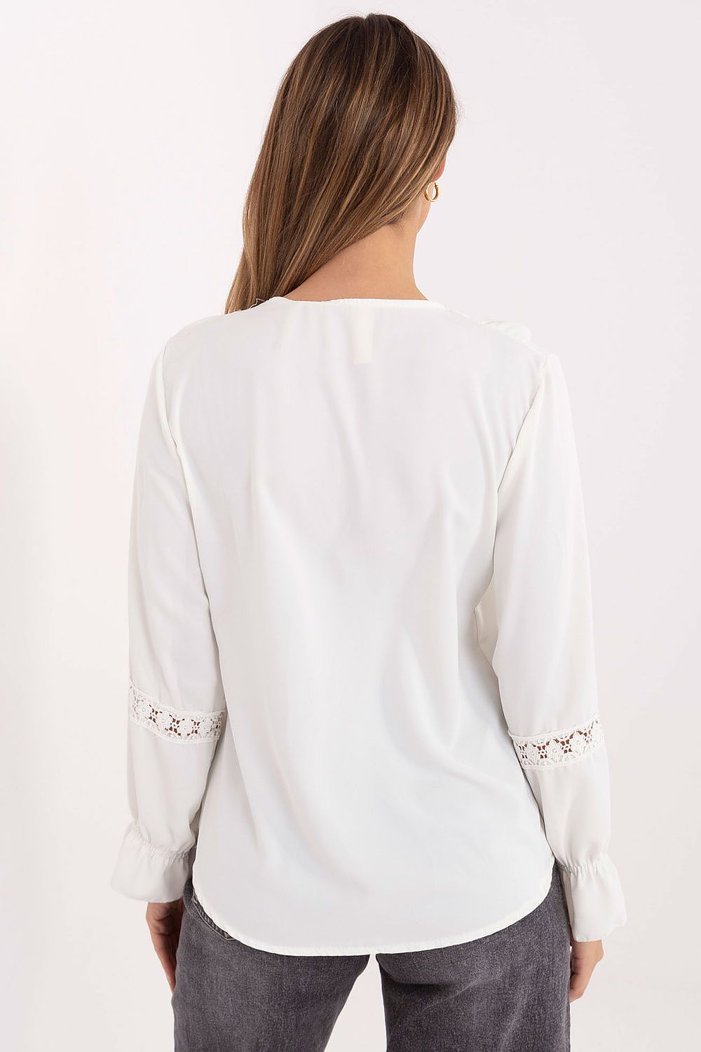 Elegant women's blouse by Italy Moda featuring a V-neckline, ruffled sleeves, and lace inserts, perfect for formal occasions or casual wear.