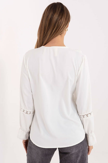 Elegant women's blouse by Italy Moda featuring a V-neckline, ruffled sleeves, and lace inserts, perfect for formal occasions or casual wear.