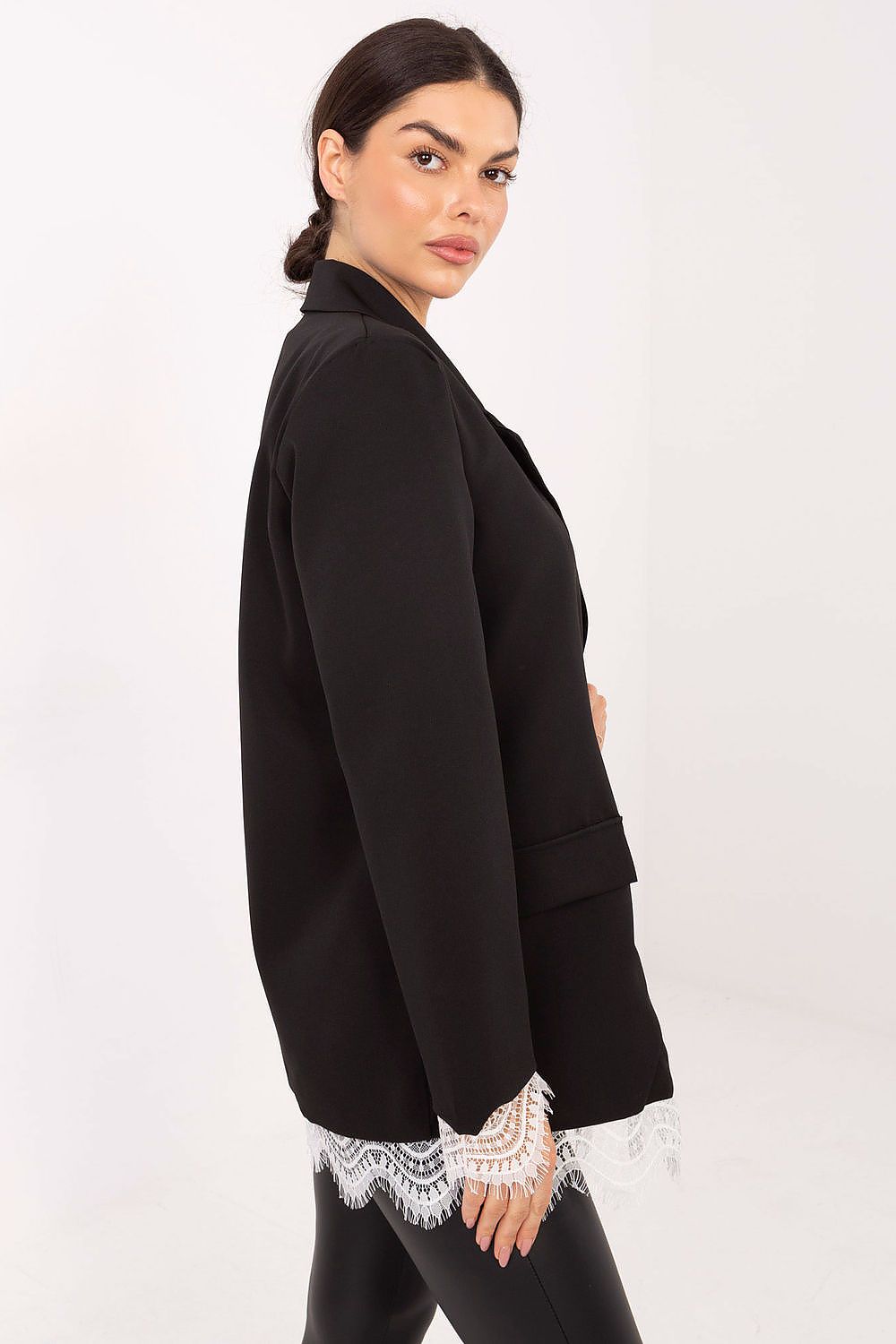 Model wearing an elegant women's blazer from Italy Moda, styled for a chic evening event, highlighting its classic silhouette and lace accents.