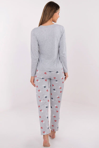 Chic long pants with repeating heart patterns from Forever Pink's women's pajama set, designed for relaxation and style.