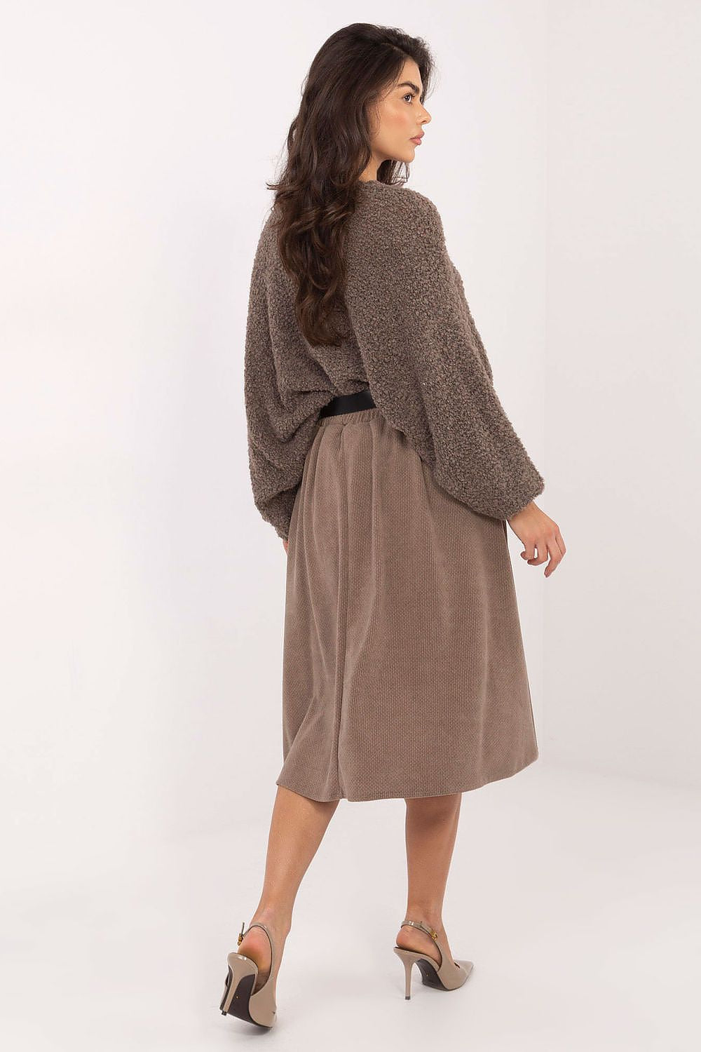 Chic Rue Paris knee-length flared skirt styled with a belt, accentuating the waist and adding a touch of sophistication to any outfit.