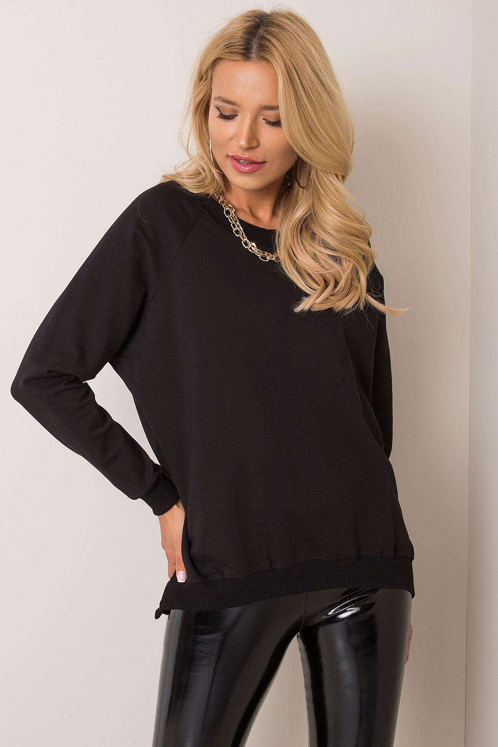 Luxurious Rue Paris cotton sweatshirt in elegant loose cut, perfect for modern women seeking comfort and style.