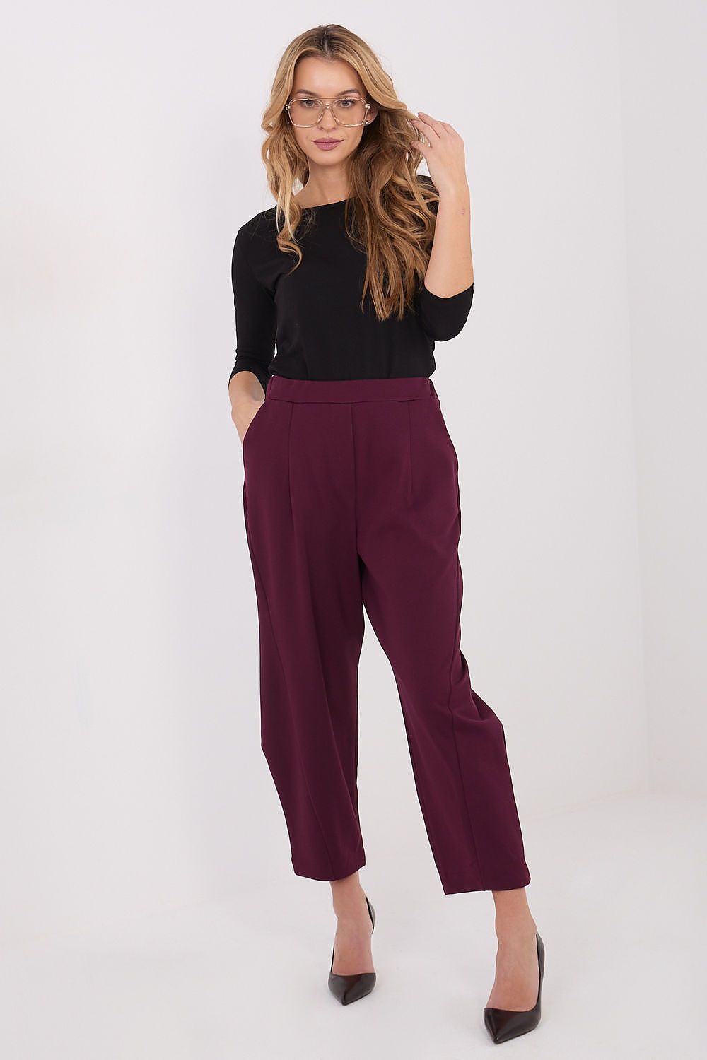 Chic side view of Rue Paris high-waisted trousers, highlighting the tapered leg design and minimalist silhouette.