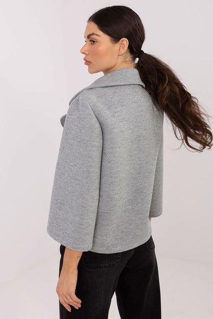 Elegant 3/4 sleeve women's coat by Rue Paris featuring stylish lapels and a decorative brooch, perfect for autumn and winter occasions. Available in EU sizes 0-6, crafted from a luxurious blend of polyester, viscose, and elastane.