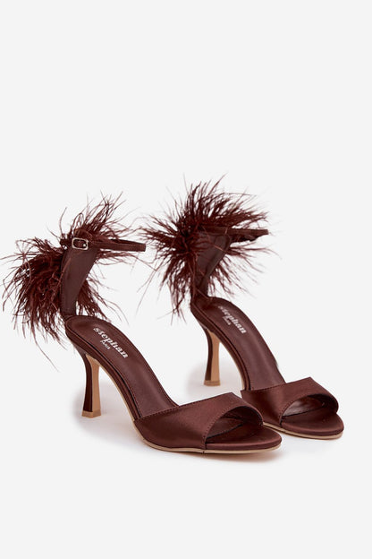 Elegant women's heel sandals by Step in Style, featuring decorative feathers and an ankle strap, perfect for special occasions.