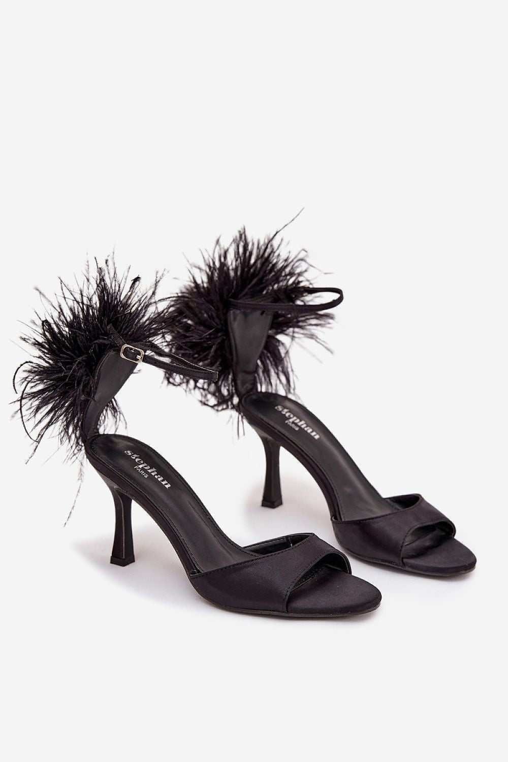Fashionable women's sandals adorned with decorative feathers, ankle strap by Step in Style, perfect for dazzling looks at parties and events.