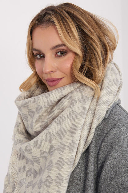 Elegant 148x148cm geometric shawl with fringes by AT, showcasing a luxurious blend of viscose and wool.