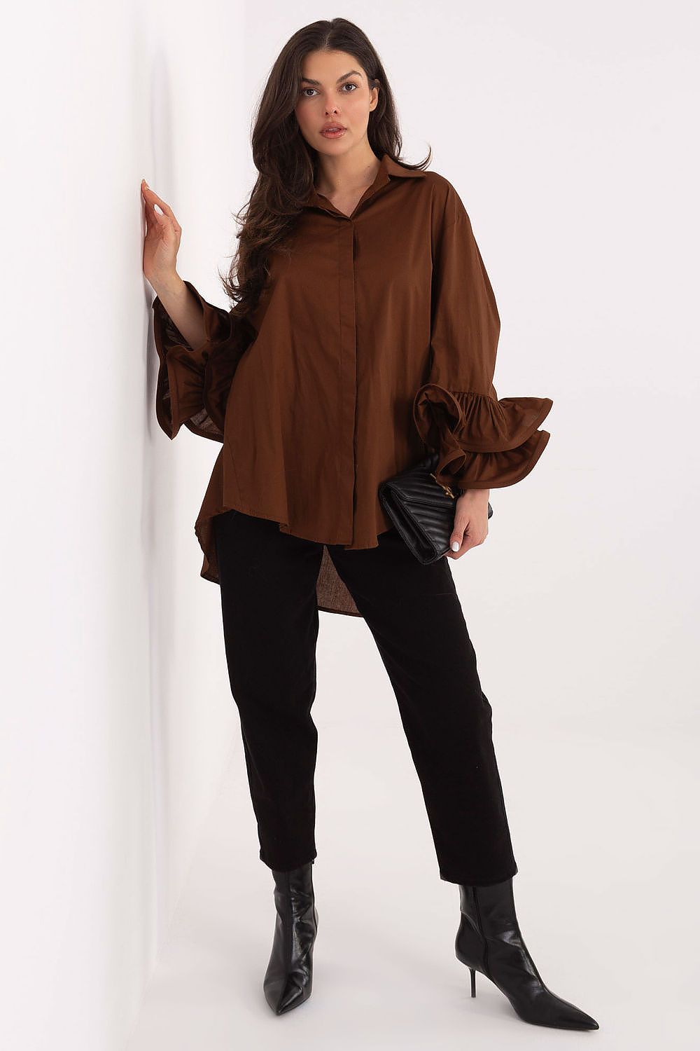 Side view of the Italy Moda long sleeve cotton shirt with ruffles, highlighting its modern silhouette and feminine elegance.