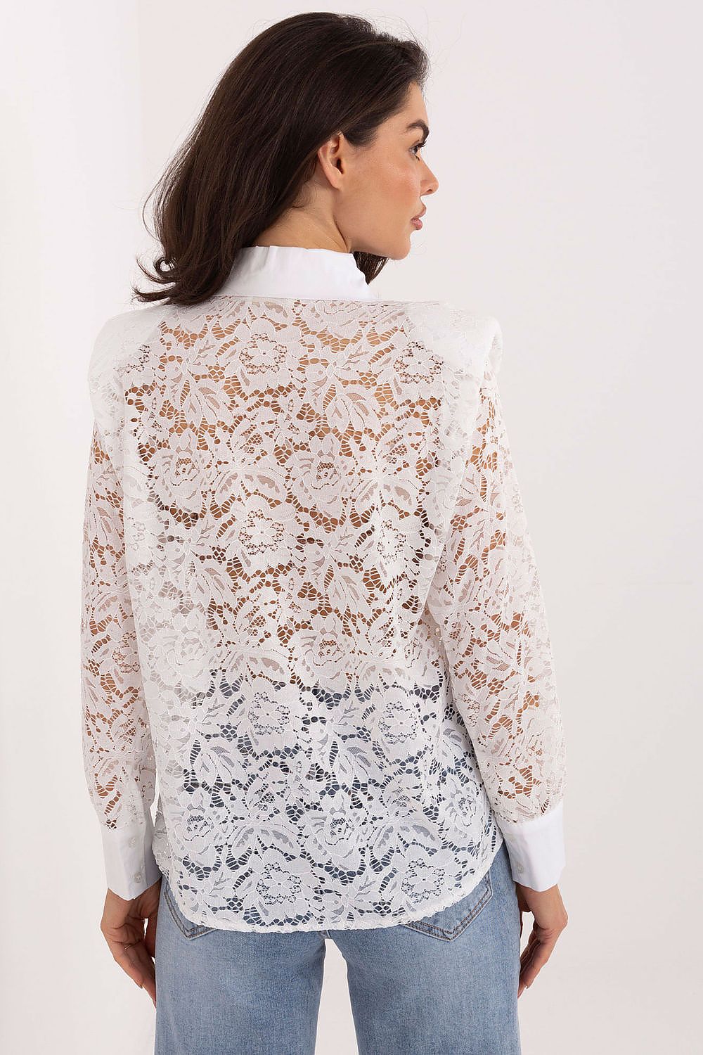 Stylish brooch accent on Italy Moda's elegant long sleeve lace shirt, enhancing its sophisticated appeal for chic stylizations.