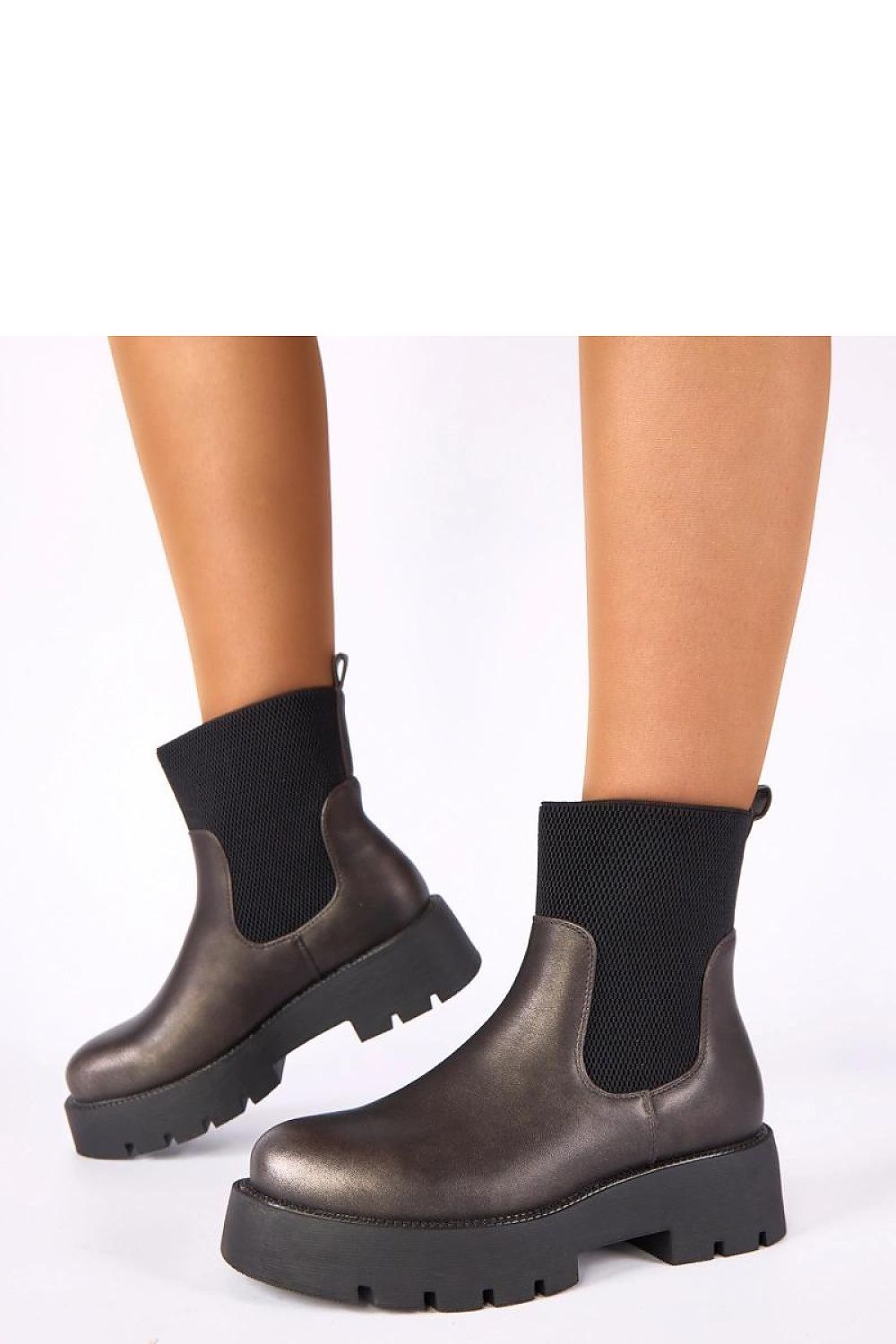 Close-up of Solea Berniece Metallic Platform Ankle Boots highlighting the modern design and detailed craftsmanship, perfect for stylish everyday wear.