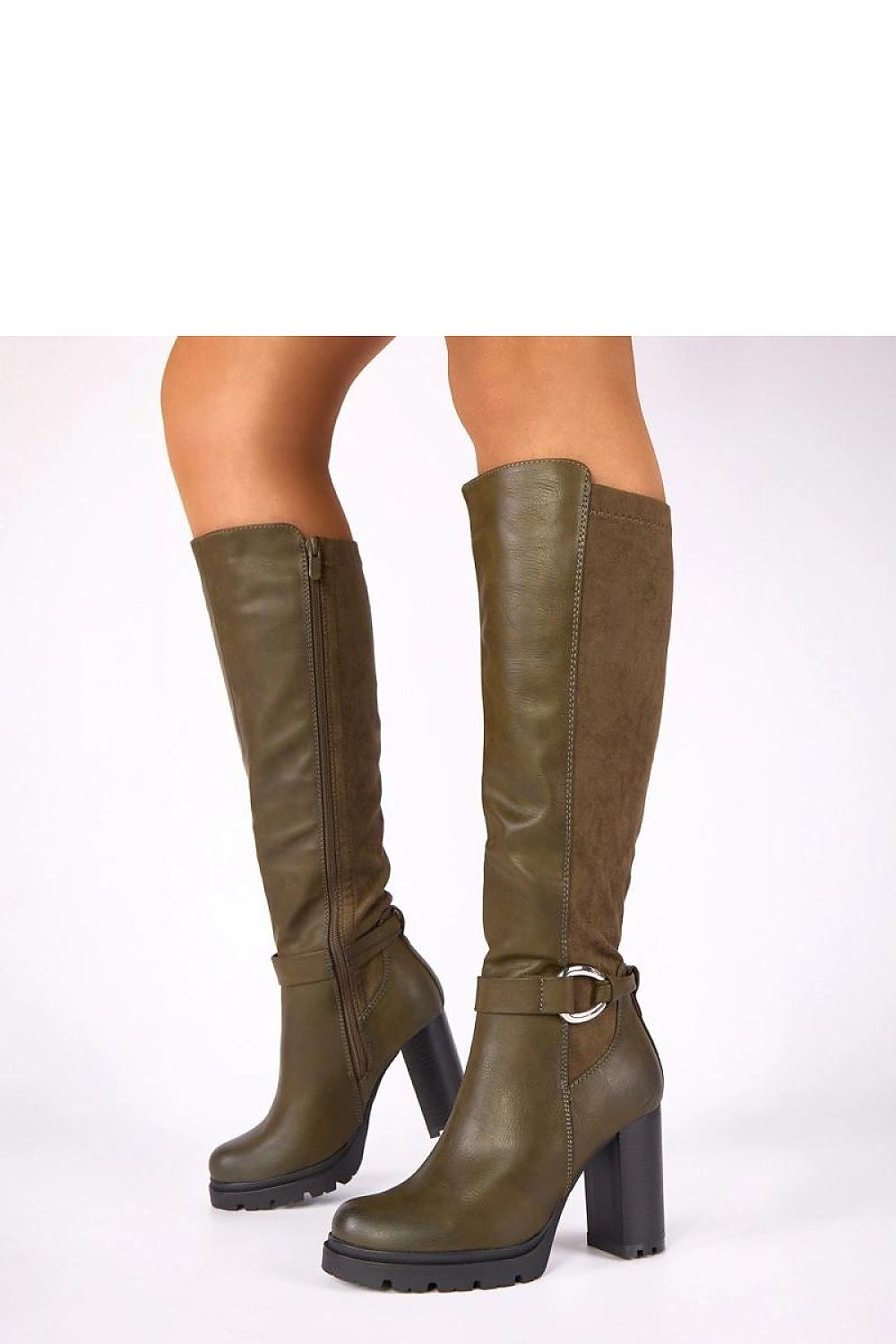 Stylish Zulma green block heel boots from Solea showcased on a post, highlighting their unique buckle detail and sophisticated design ideal for both casual and formal occasions.