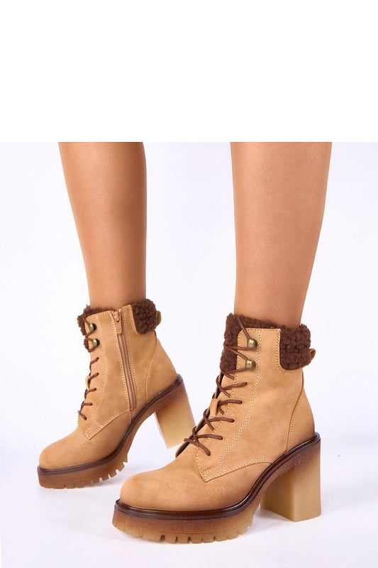 Close-up view of Gemre Alona ankle boots by Solea, featuring soft fur lining for added comfort and refined look in stylish beige.