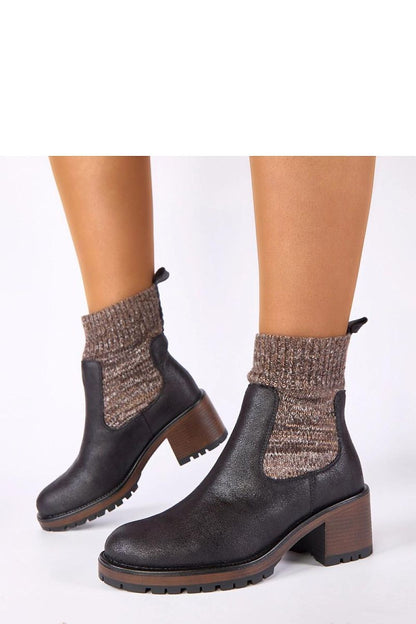 Stylish Solea women's ankle boots in classic black, showcasing a flexible sock-like design, ideal for versatile outfits from casual to formal.