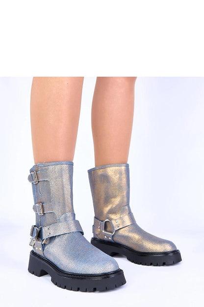Luxurious blue boots by Solea, featuring elegant gold buckles, designed for sophisticated women who appreciate sleek style.