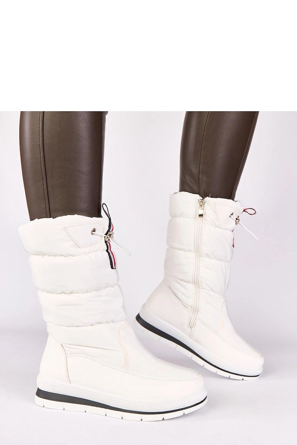 Solea white low wedge snow boots featuring a stylish drawstring design, perfect for chic winter fashion with comfort and warmth for women.